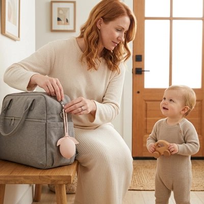 porte-tétine ajoutées sur un sac à couches